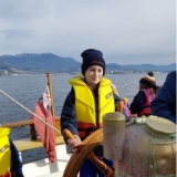 School children on the helm